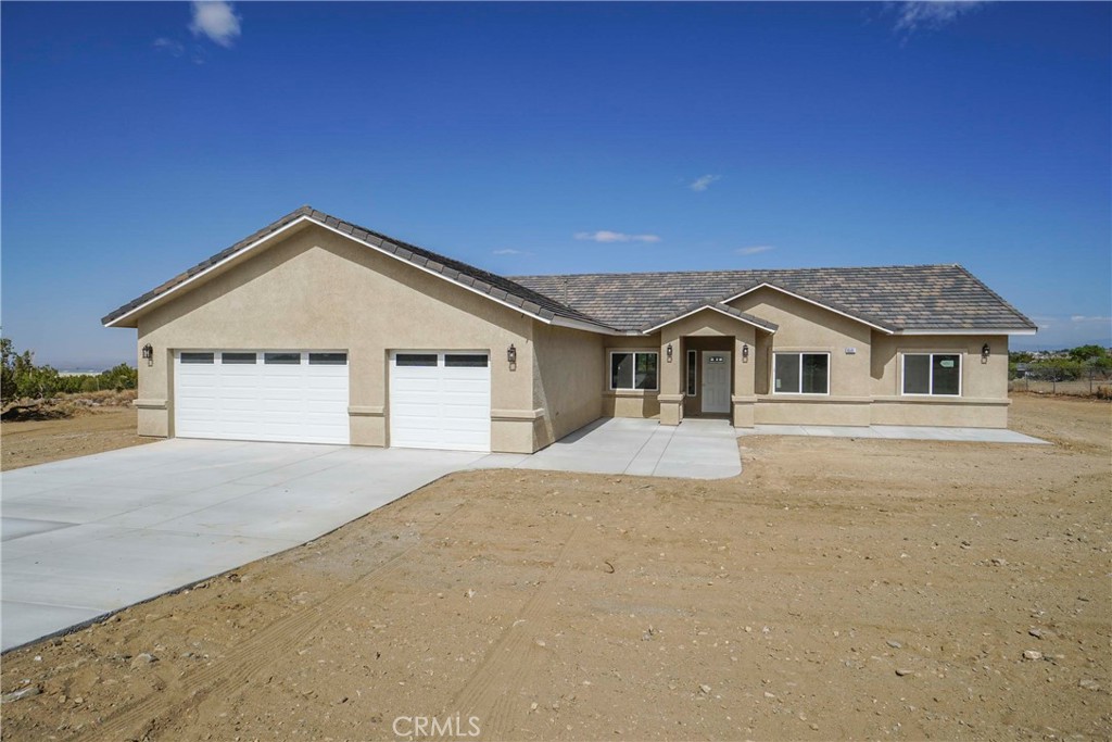 9501 Burbank Road Pinon Hills, CA 92371 - Photo 1 of 1 a view of house with garage and yard