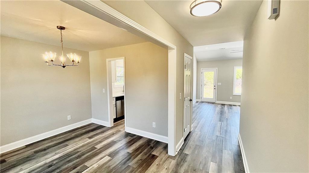 5 Green Road Griffin, GA 30224 - Photo 5 of 34 a view of a room with wooden floor and staircase