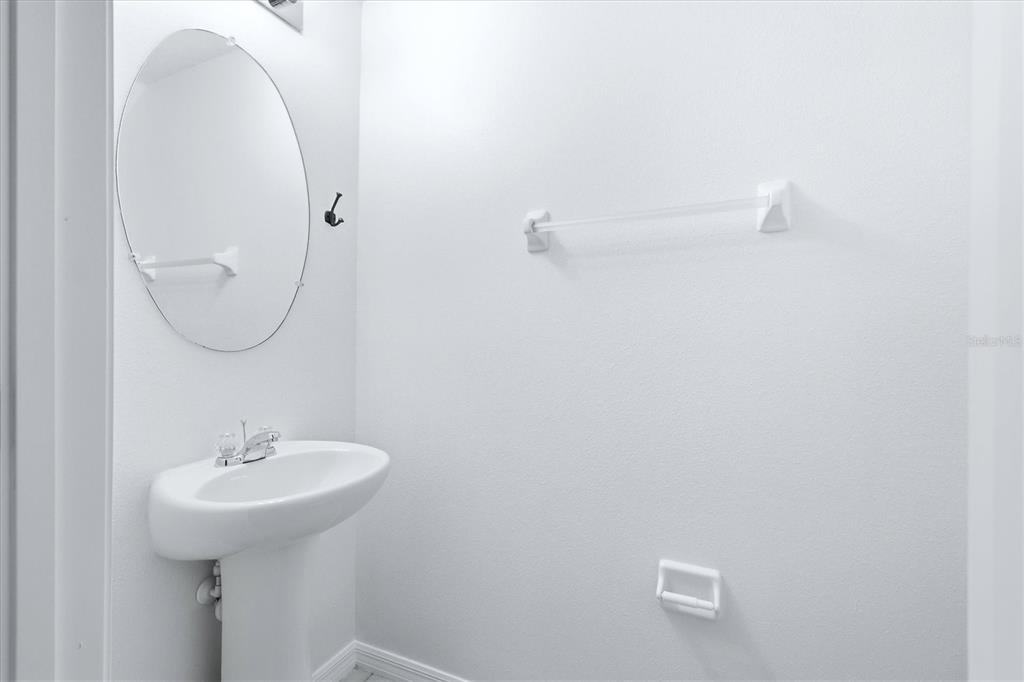 12909 Dream Catcher Way Riverview, FL 33579 - Photo 15 of 32 a bathroom with a sink and a mirror