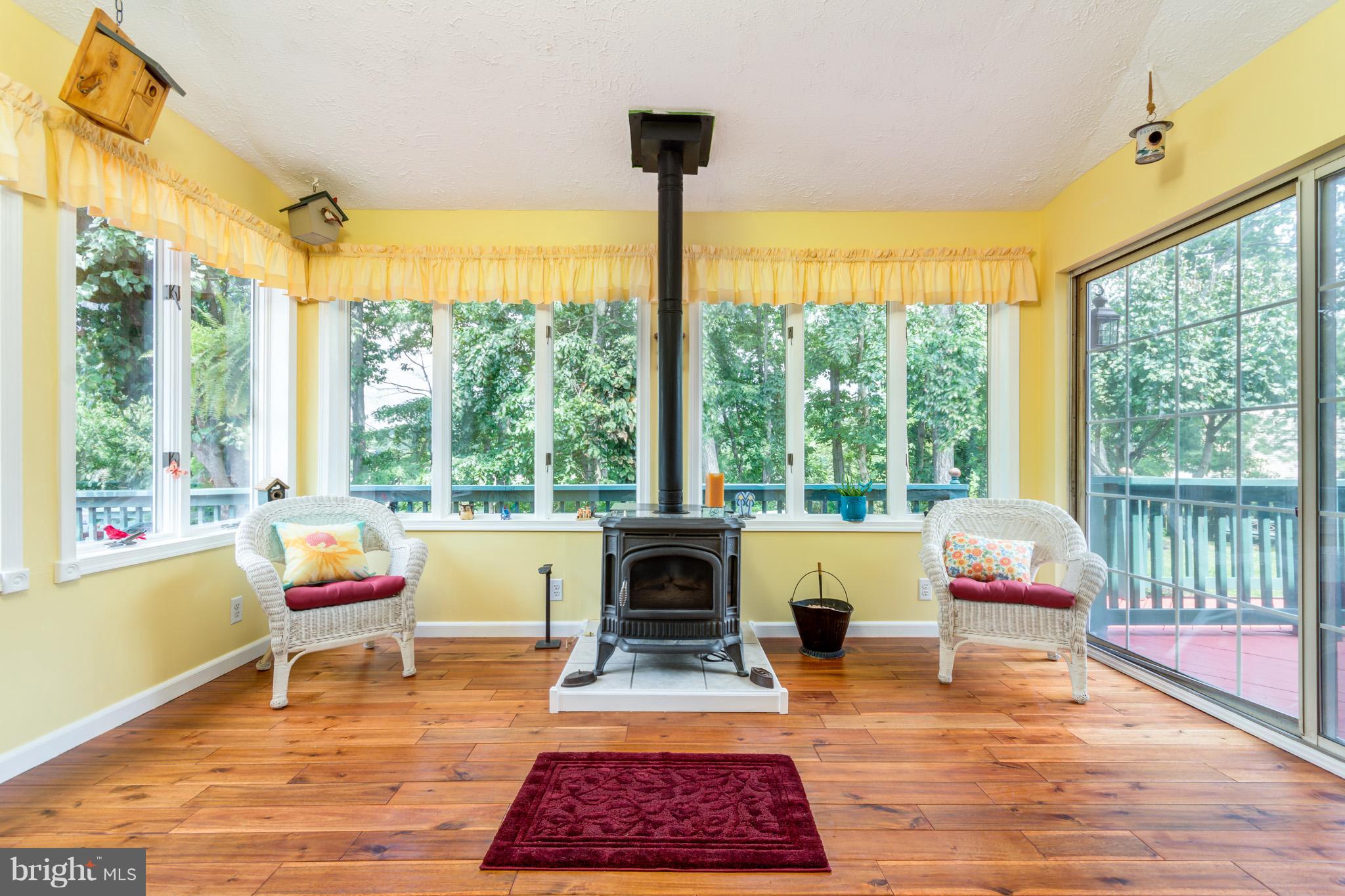 9004 Moonstone Road Baltimore, MD 21236 - Photo 12 of 30 Sunroom Views of Trees and Pool/Pellet Stove