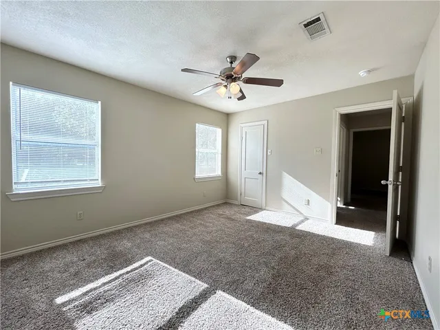 a view of livingroom with hardwood floor and ceiling fan