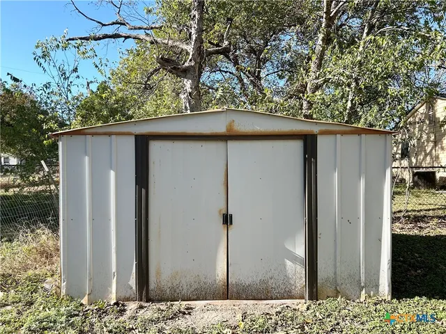 a wooden door in front of house