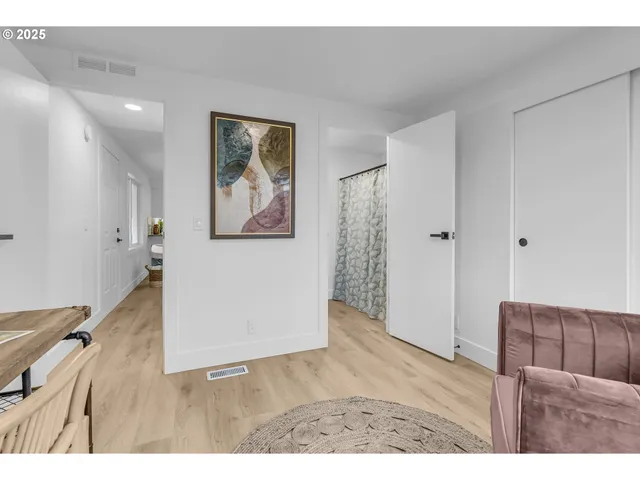 a bathroom with a granite countertop sink a toilet and a mirror