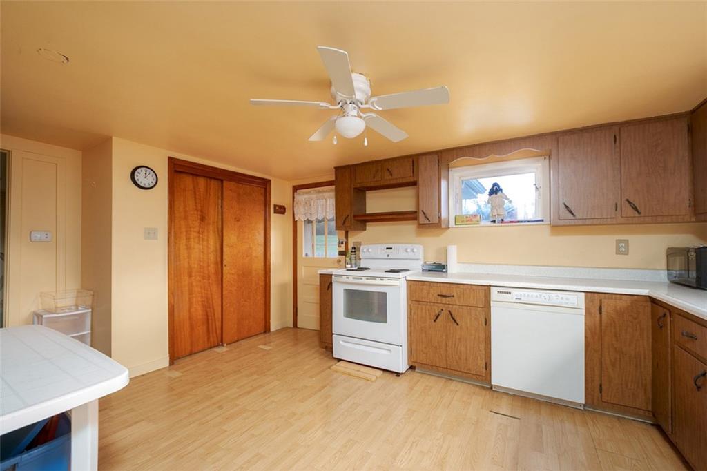 2793 Italy Road Export, PA 15632 - Photo 12 of 23 a kitchen with stainless steel appliances a sink a stove a refrigerator cabinets and a window