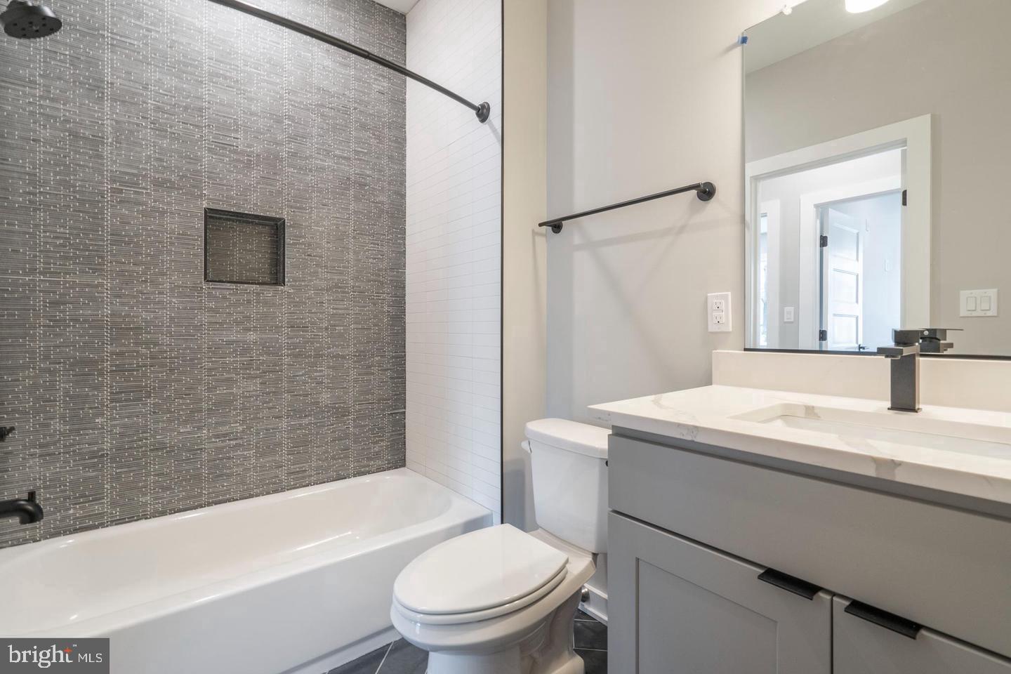 3401 Hamilton Street, Unit 4 Philadelphia, PA 19104 - Photo 28 of 33 a bathroom with a sink a toilet and shower