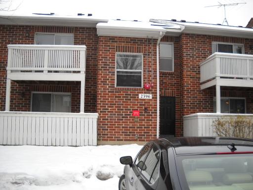 2396 South Goebbert Road, Unit 2031 Arlington Heights, IL 60005 - Photo 1 of 1 a view of a house with a yard