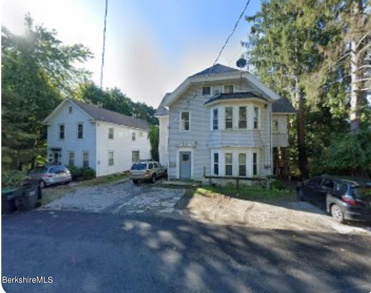 110 Maple Street Lee, MA 01238 - Photo 1 of 1 a front view of a house with a yard