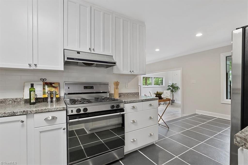 140 Penny Road Jamestown, NC 27282 - Photo 10 of 34 Gas range and new tile backspash