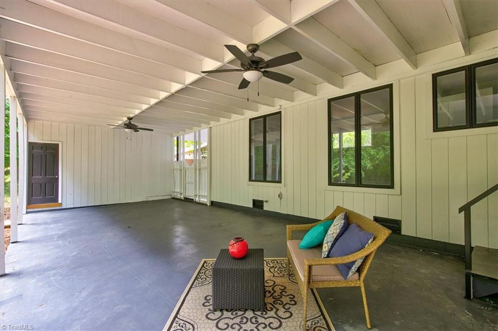 140 Penny Road Jamestown, NC 27282 - Photo 15 of 34 I cannot say enough about this outdoor covered space! Door in distant left shows storage area which is very spacious!