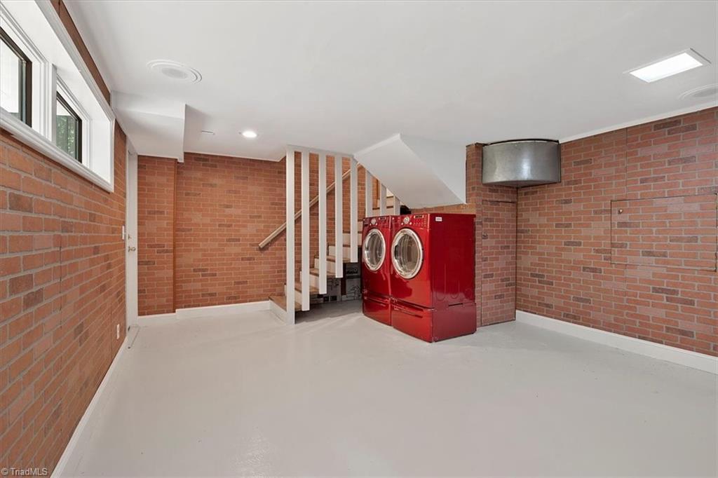 140 Penny Road Jamestown, NC 27282 - Photo 21 of 34 Basement space provides laundry area and SOOO Much storage!