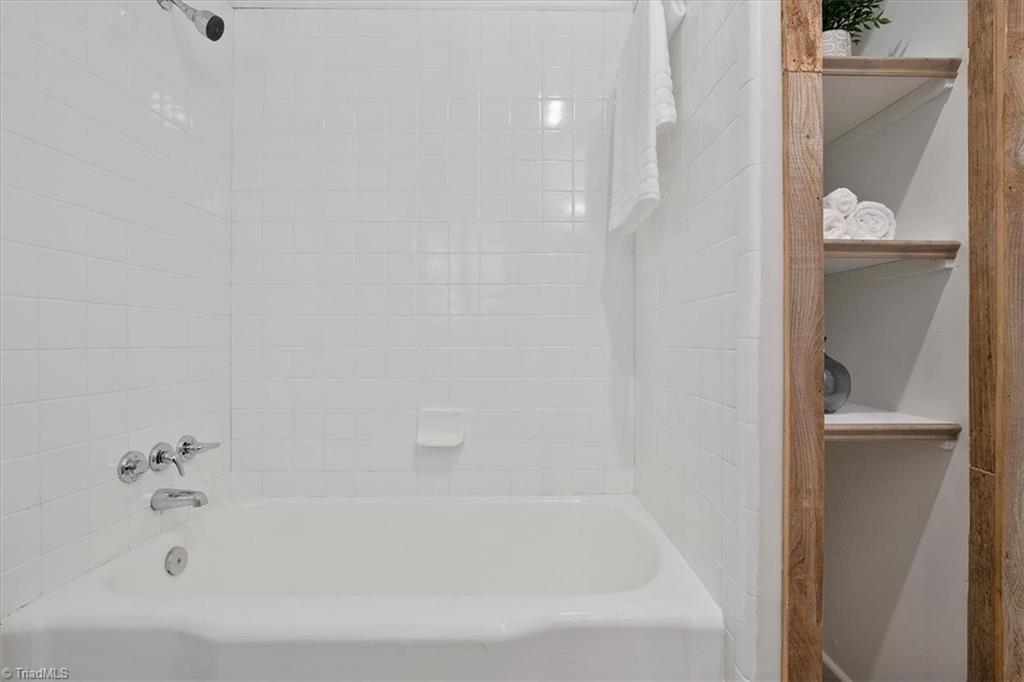 140 Penny Road Jamestown, NC 27282 - Photo 28 of 34 Full bath remodeled off primary bedroom and access to hallway