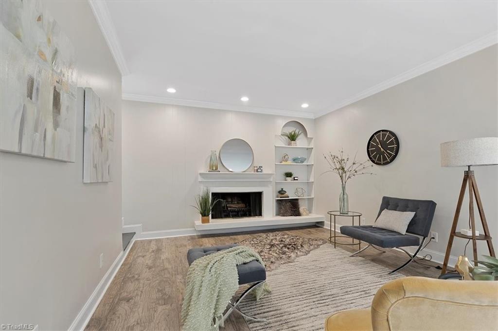 140 Penny Road Jamestown, NC 27282 - Photo 4 of 34 Great open space as you enter with amazing fireplace and built in bookcase!