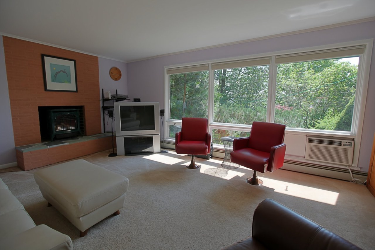 375 Main Road Monterey, MA 01245 - Photo 11 of 19 a living room with furniture a fireplace and a floor to ceiling window
