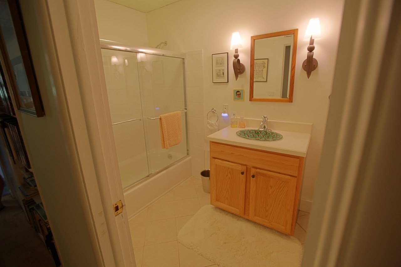 375 Main Road Monterey, MA 01245 - Photo 14 of 19 a bathroom with a sink vanity granite tub shower and a mirror
