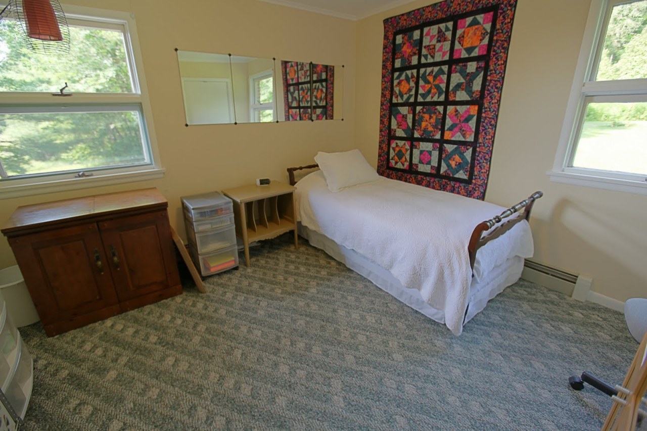 375 Main Road Monterey, MA 01245 - Photo 18 of 19 a spacious bedroom with a bed and a window