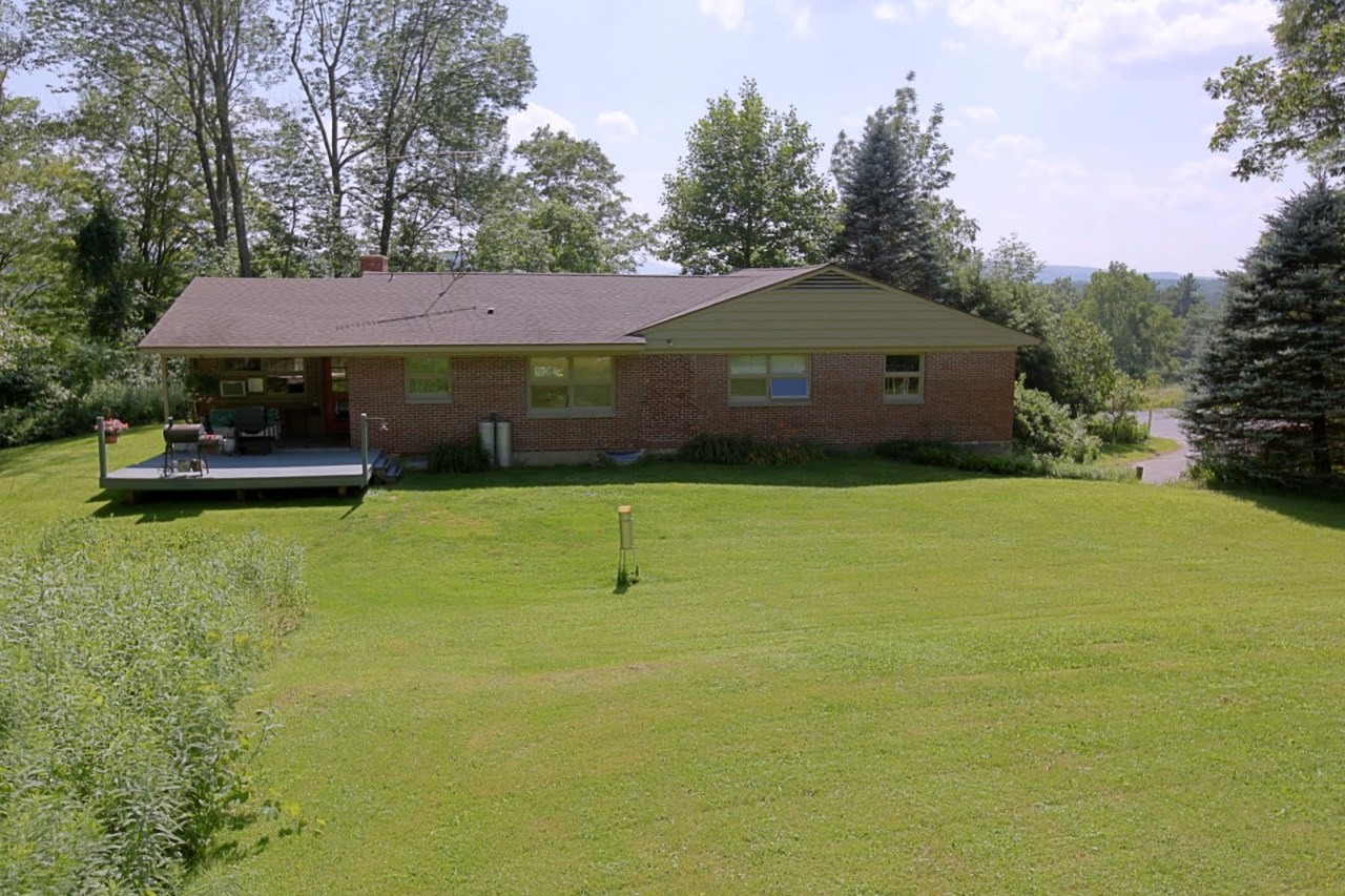 375 Main Road Monterey, MA 01245 - Photo 19 of 19 a front view of house with yard and trees