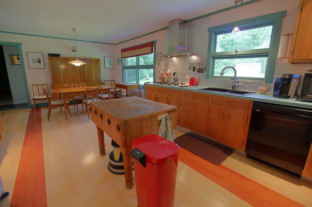 375 Main Road Monterey, MA 01245 - Photo 6 of 19 a kitchen with stainless steel appliances granite countertop a stove a sink and a dining table with granite countertops