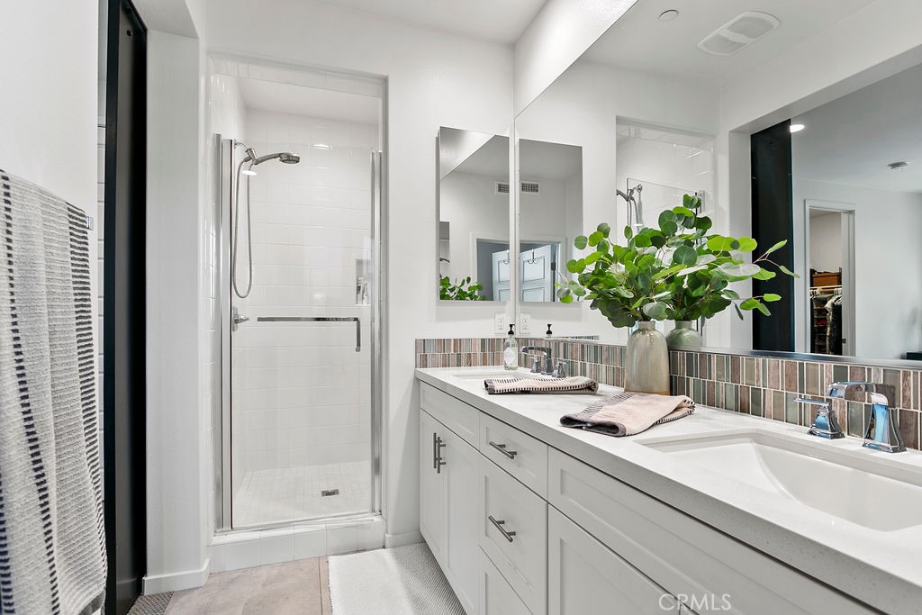 152 Modjeska Irvine, CA 92618 - Photo 16 of 30 a bathroom with a sink double vanity and a mirror