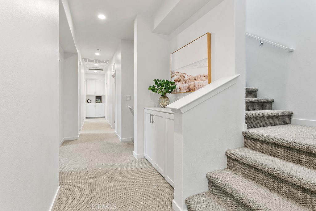 152 Modjeska Irvine, CA 92618 - Photo 23 of 30 a view of a hallway with wooden floor and furniture