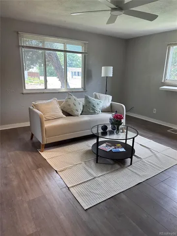 a living room with furniture and a window