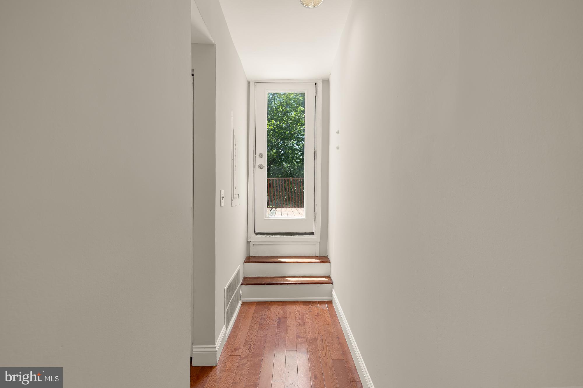 601 L Street Northeast Washington, DC 20002 - Photo 18 of 47 a view of a hallway with wooden floor and a window