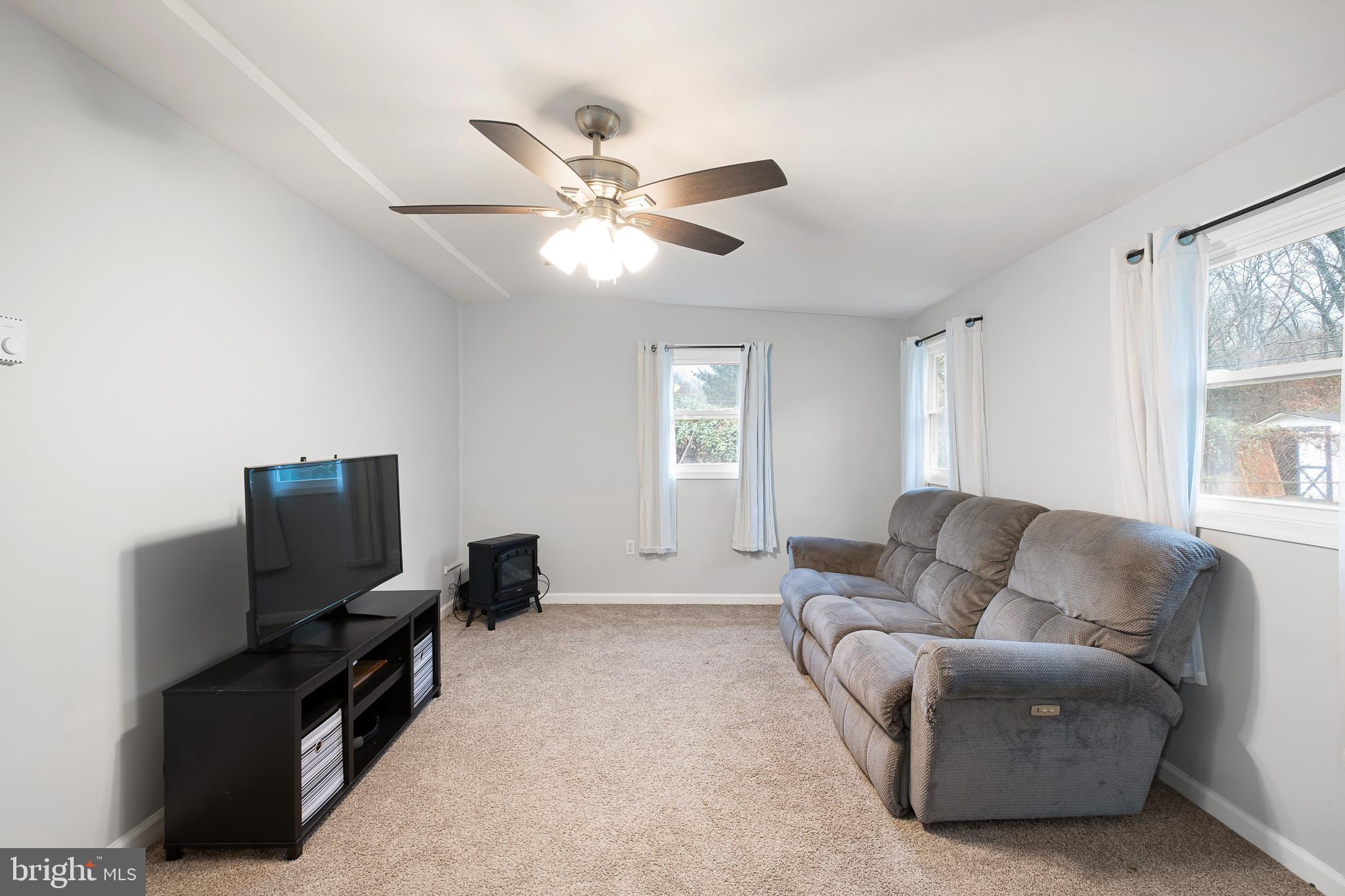 107 Anderson Road Newark, DE 19713 - Photo 15 of 28 a living room with furniture and a flat screen tv