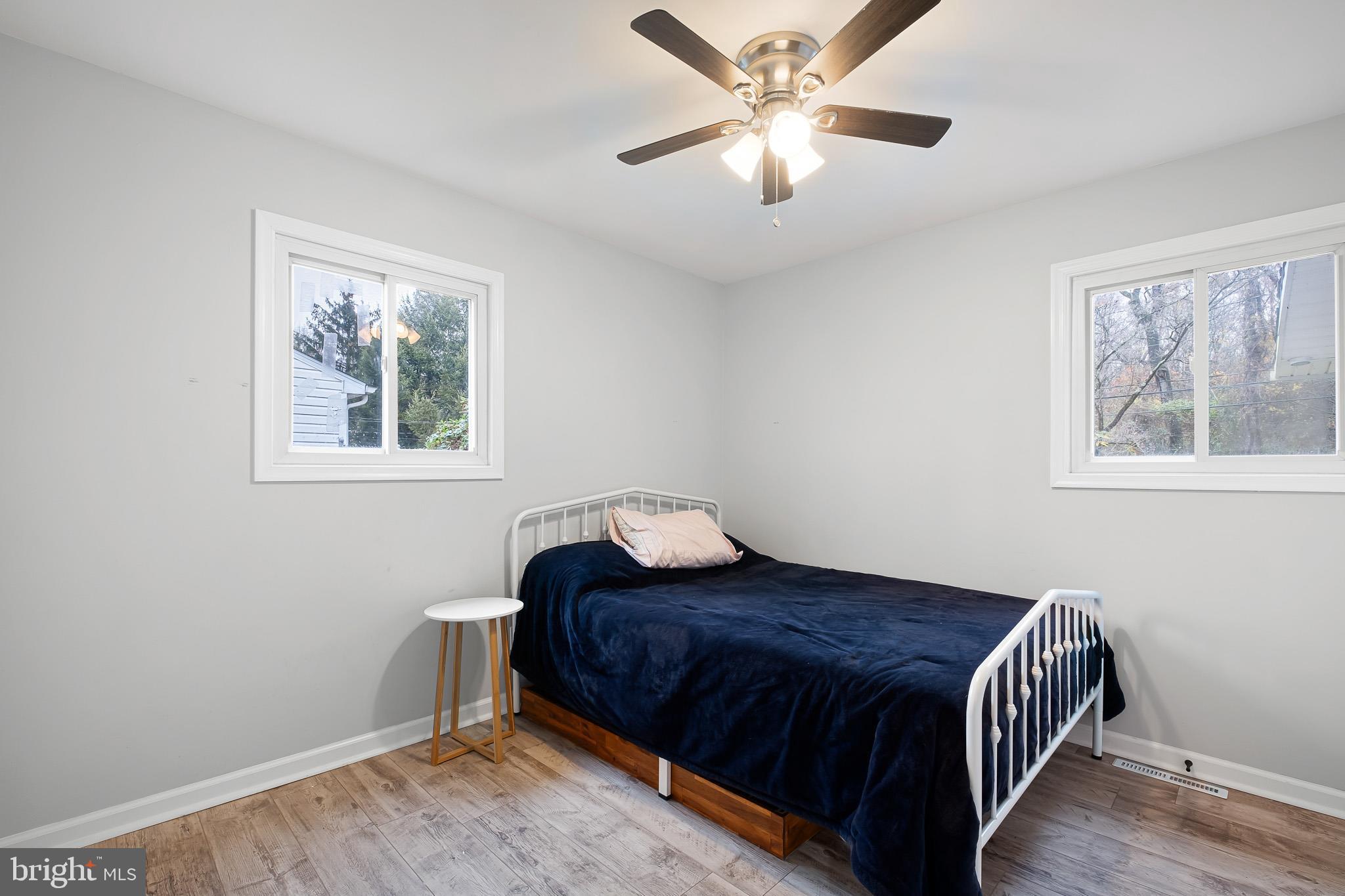 107 Anderson Road Newark, DE 19713 - Photo 19 of 28 a bedroom with a bed and a chandelier