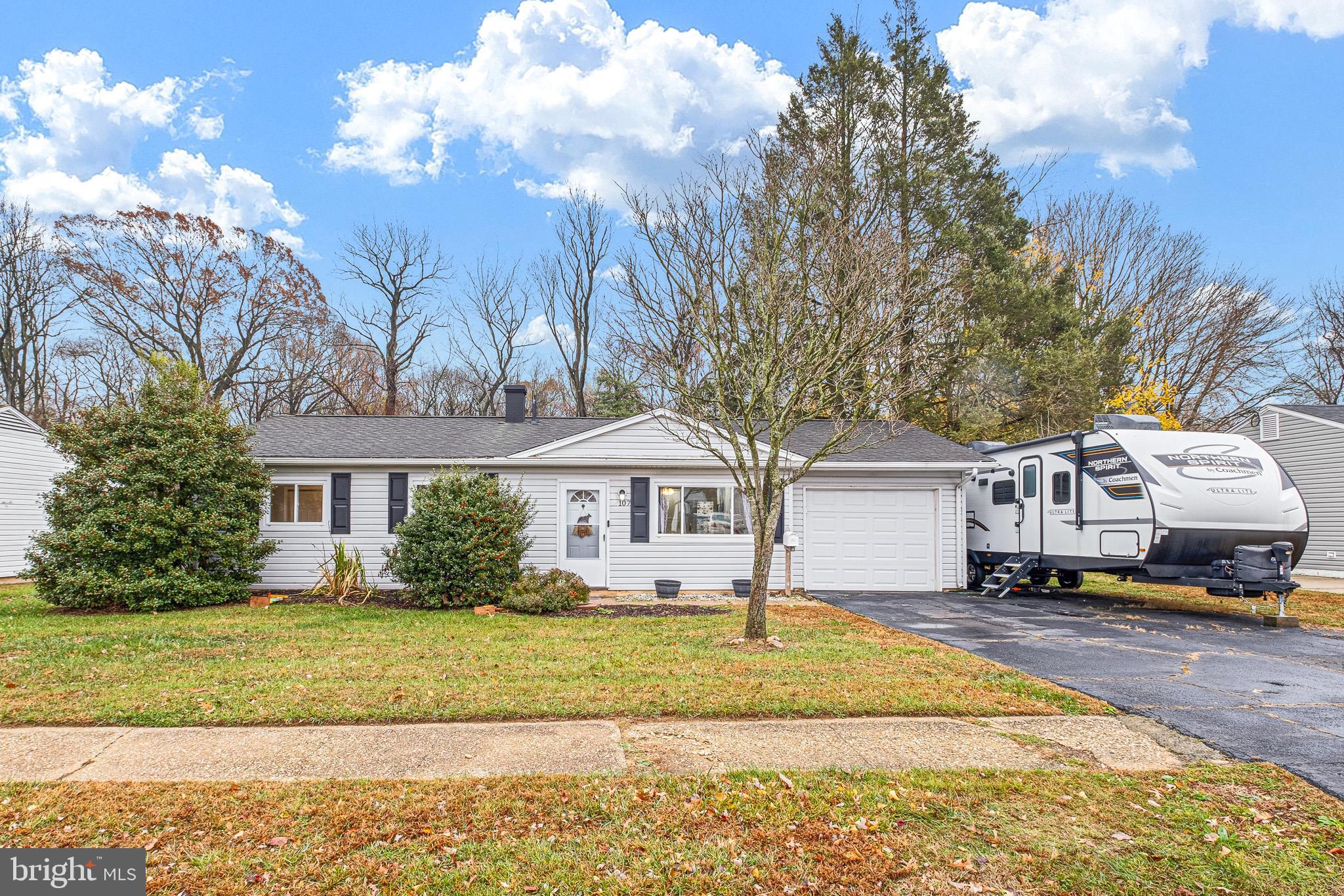 107 Anderson Road Newark, DE 19713 - Photo 24 of 28 a front view of a house with a garden and trees