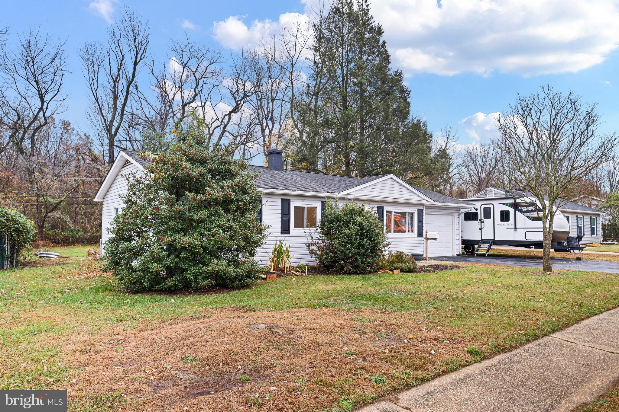 107 Anderson Road Newark, DE 19713 - Photo 26 of 28 a front view of a house with a yard and trees