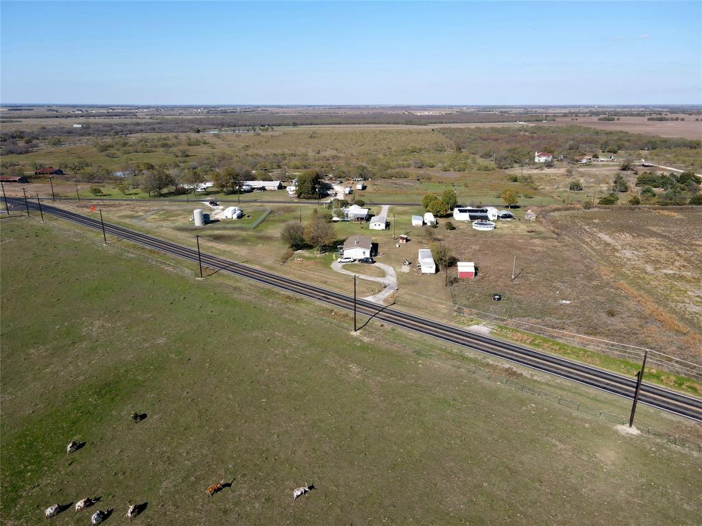 16531 Farm To Market 455 Pilot Point, TX 76258 - Photo 15 of 37 Aerial overview of property's location with rural landscape and agricultural land