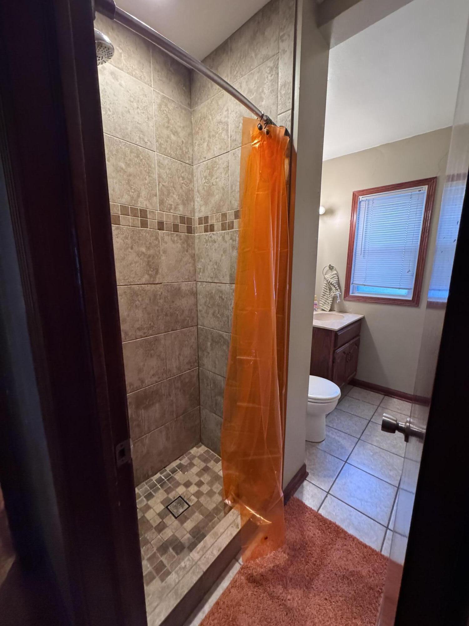 7341 Harrison Avenue Hammond, IN 46324 - Photo 13 of 16 a bathroom with a toilet and a shower