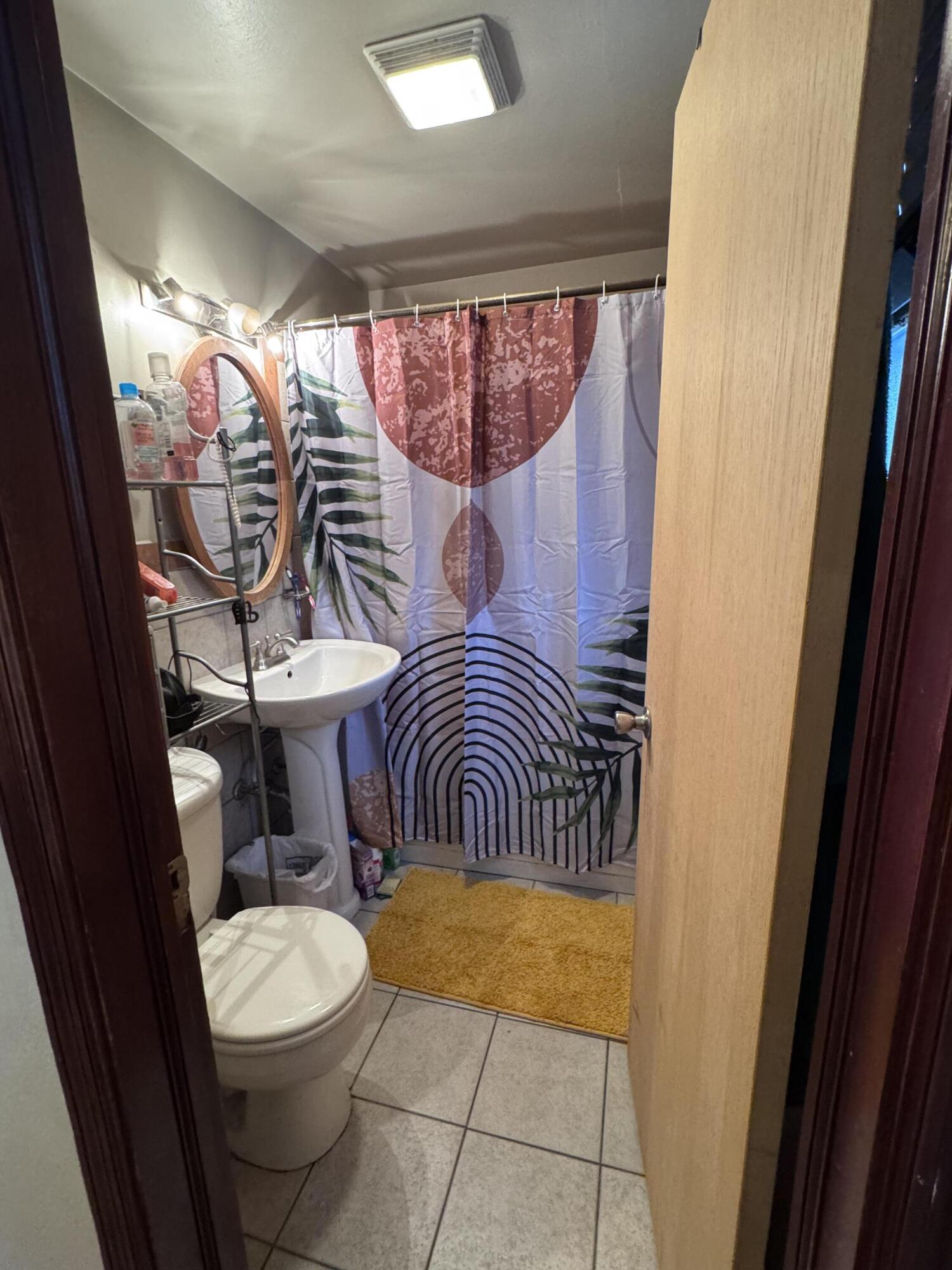 7341 Harrison Avenue Hammond, IN 46324 - Photo 16 of 16 a bathroom with a sink and a mirror