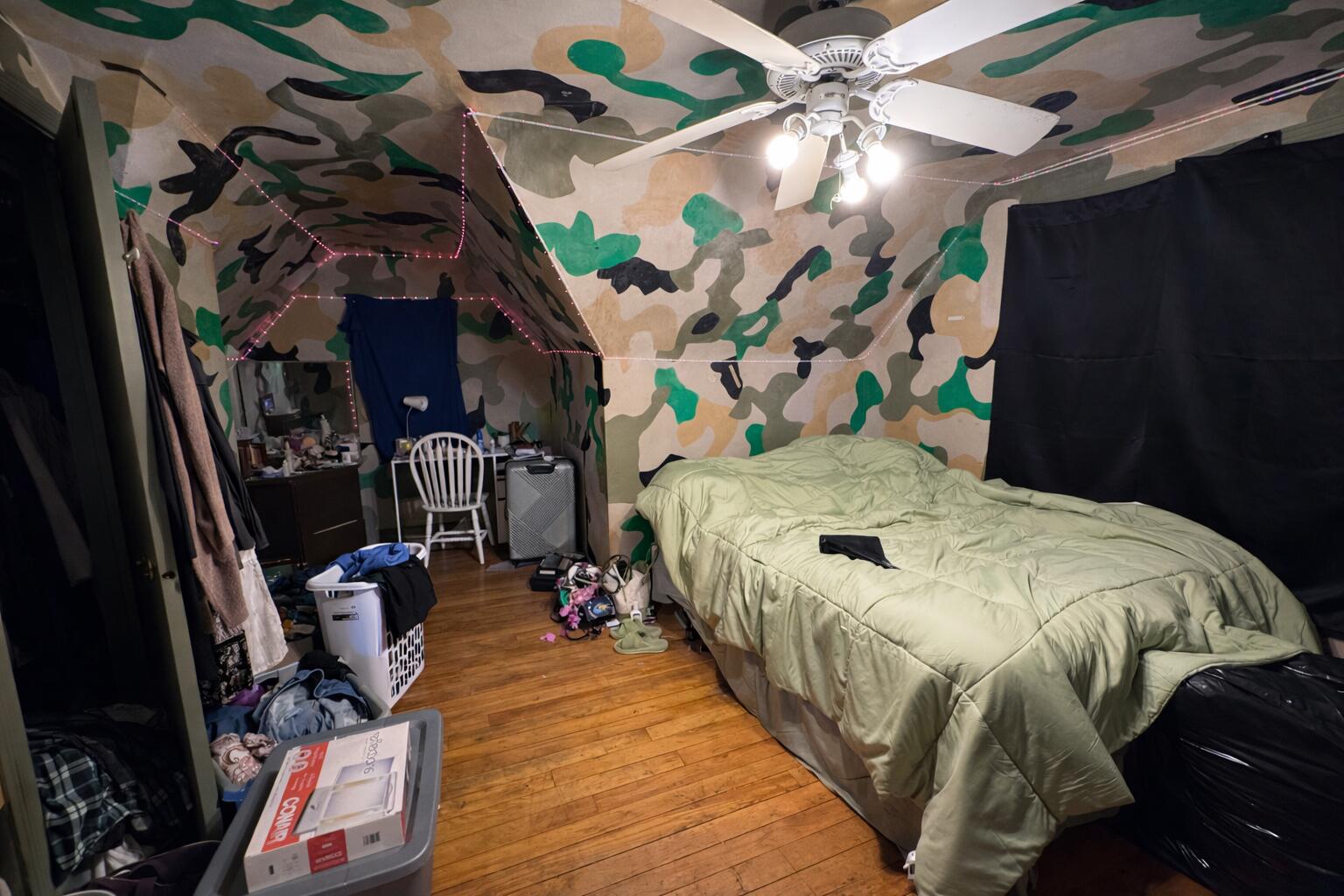 7341 Harrison Avenue Hammond, IN 46324 - Photo 9 of 16 a bed sitting in a bedroom next to a window