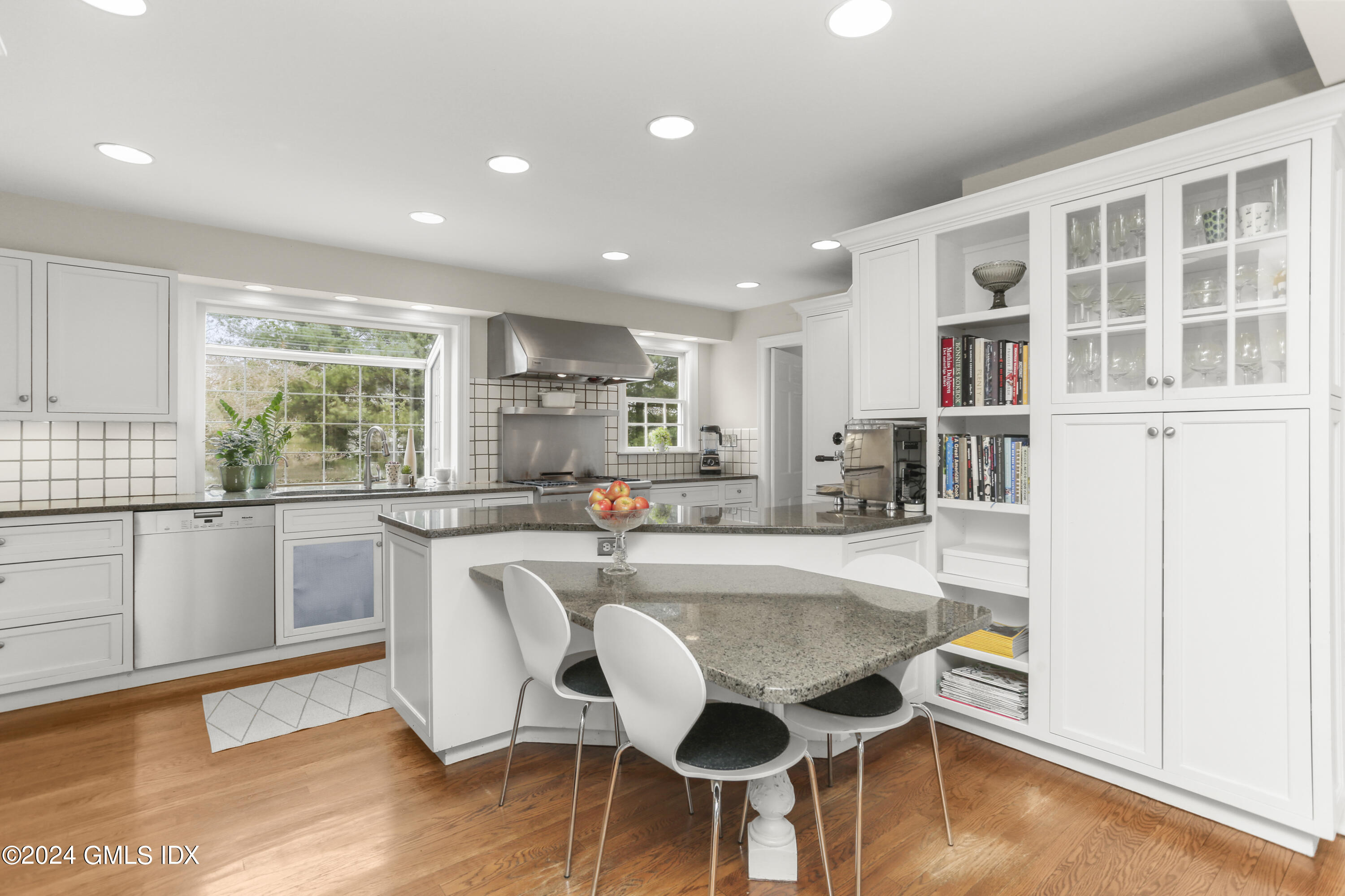 7 Willowmere Avenue Riverside, CT 06878 - Photo 14 of 31 a living room with stainless steel appliances granite countertop a kitchen island hardwood floor and a window