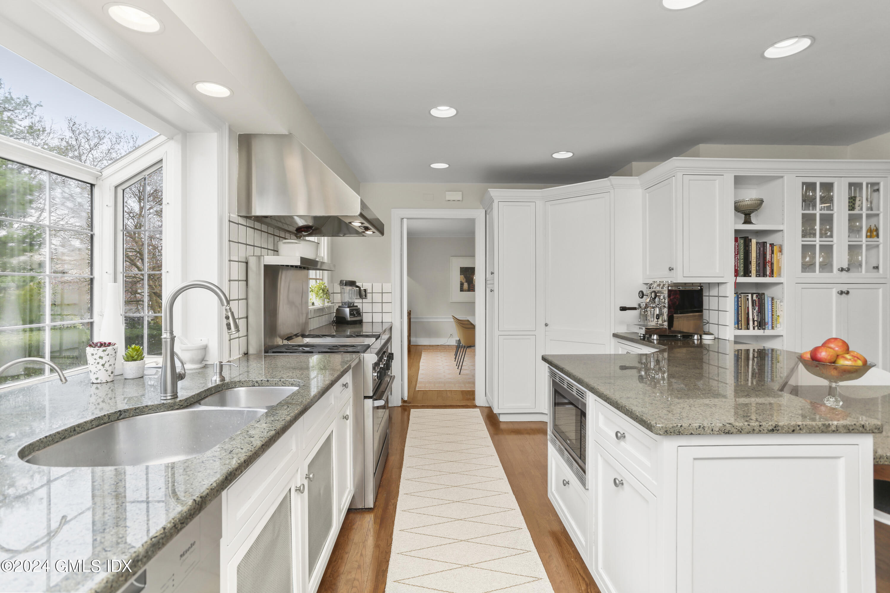 7 Willowmere Avenue Riverside, CT 06878 - Photo 15 of 31 a large kitchen with stainless steel appliances granite countertop a sink stove and cabinets