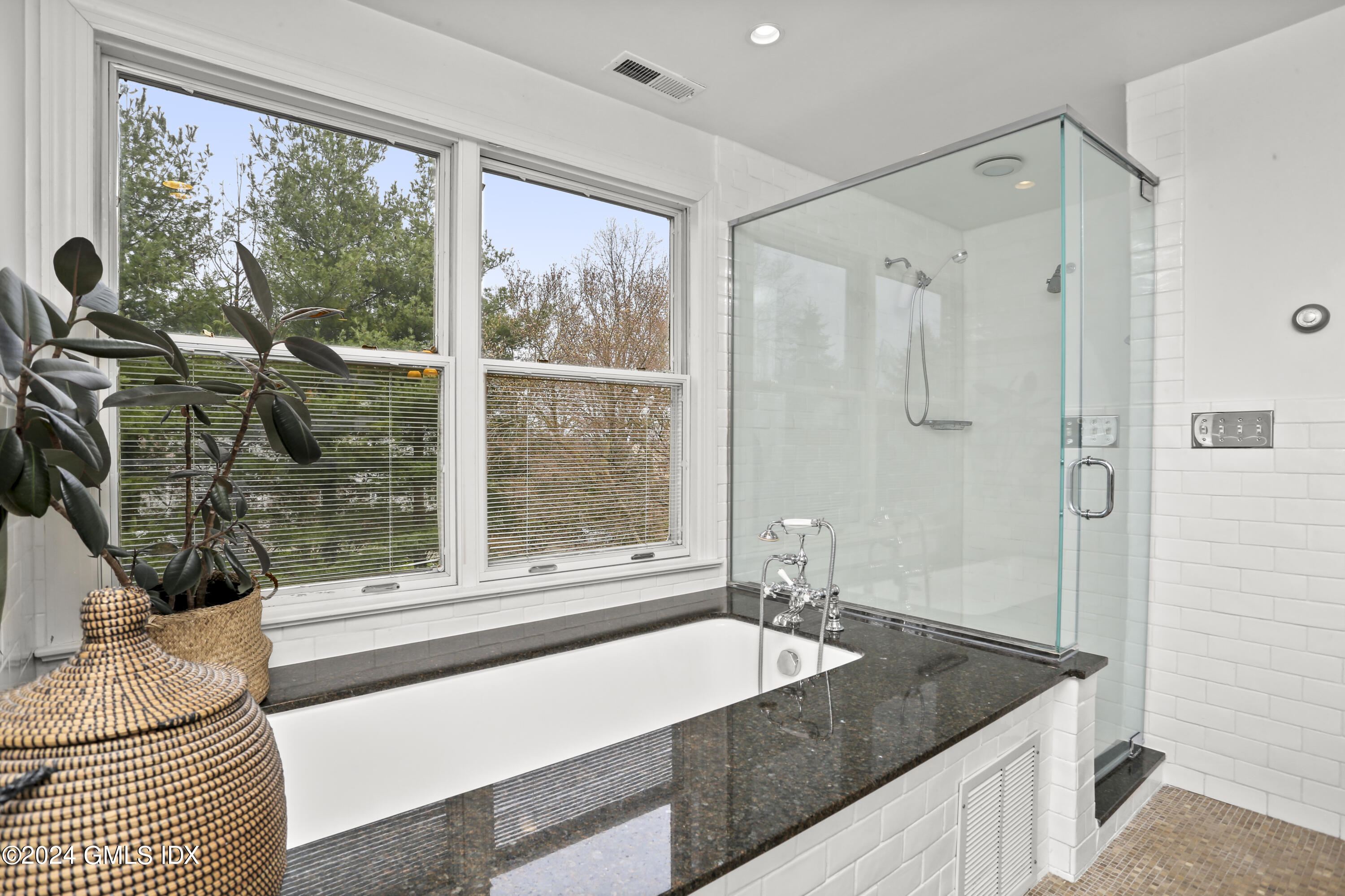 7 Willowmere Avenue Riverside, CT 06878 - Photo 17 of 31 a bathroom with a granite countertop sink and a large mirror