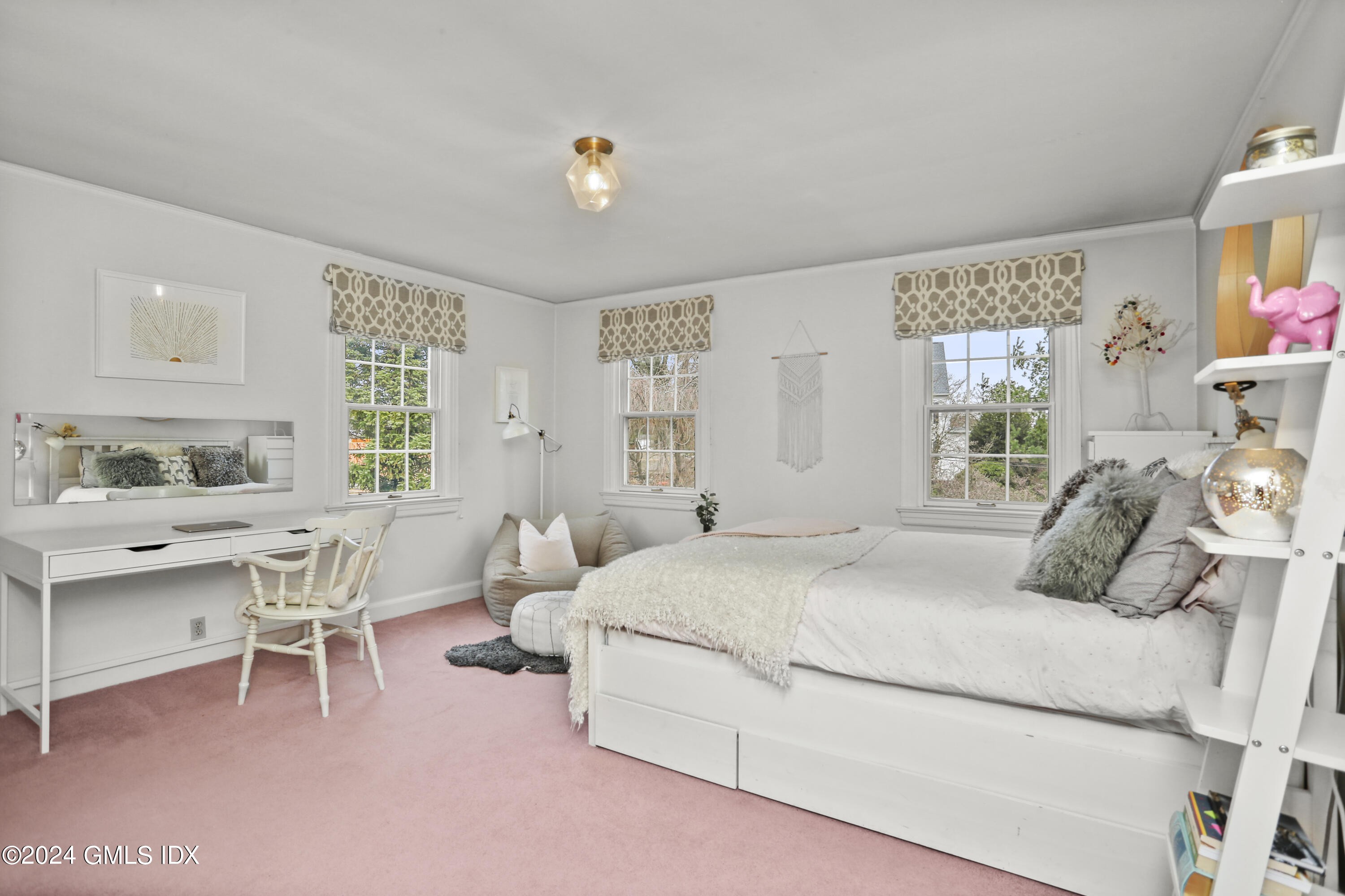 7 Willowmere Avenue Riverside, CT 06878 - Photo 21 of 31 a bedroom with a bed and a table in it