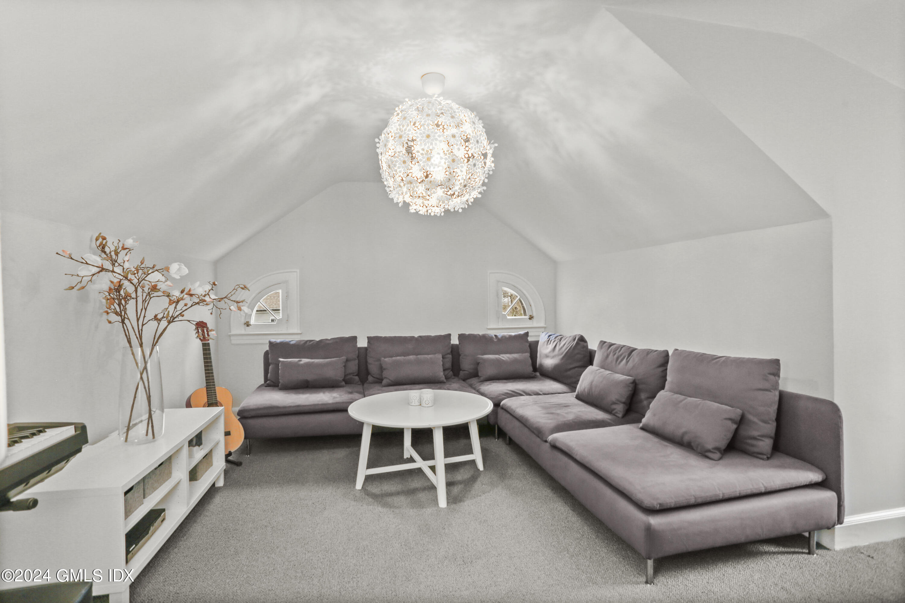 7 Willowmere Avenue Riverside, CT 06878 - Photo 23 of 31 a living room with furniture a chandelier and a couch