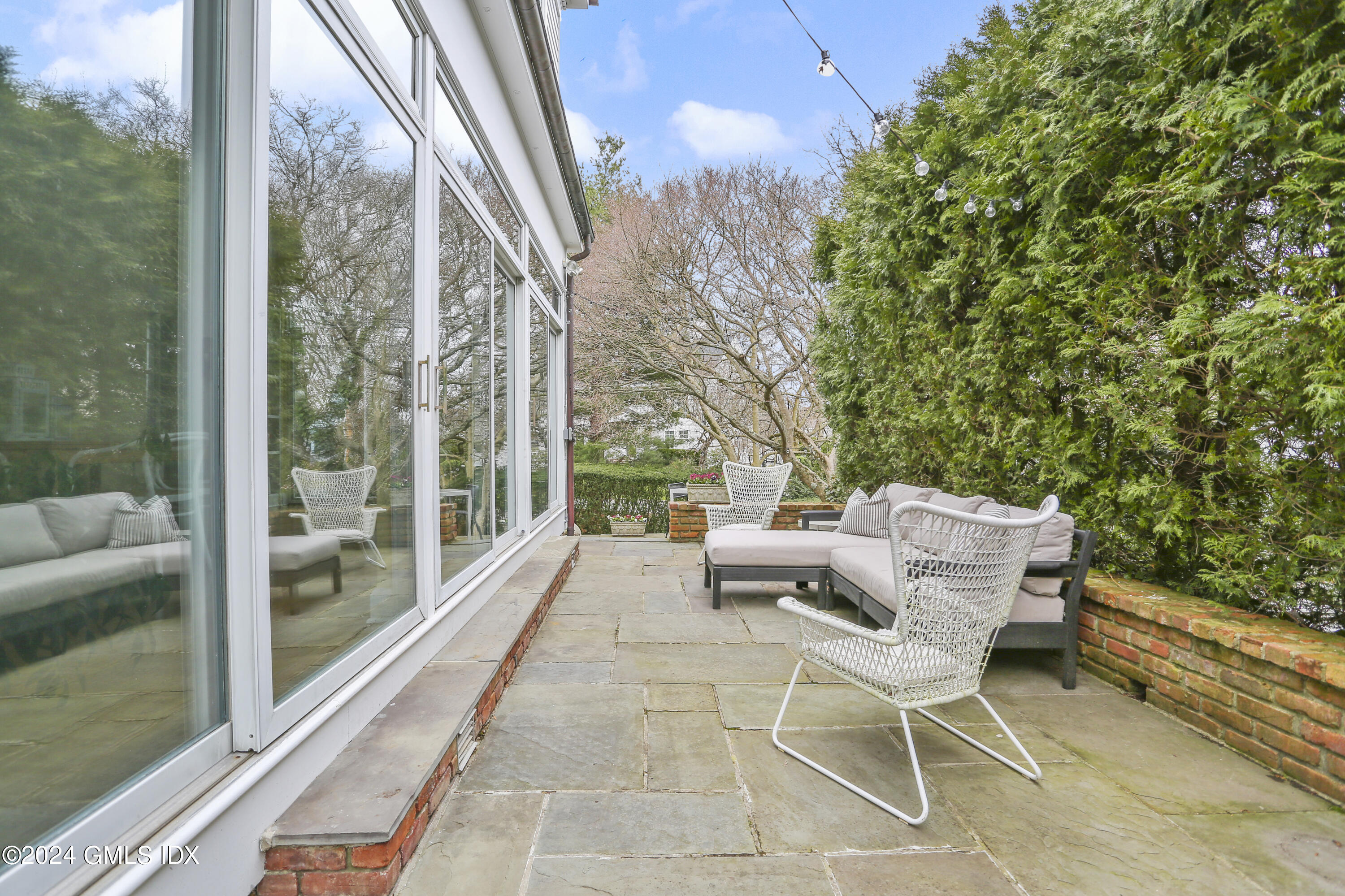 7 Willowmere Avenue Riverside, CT 06878 - Photo 8 of 31 a balcony with couple of chairs and a couple of chairs