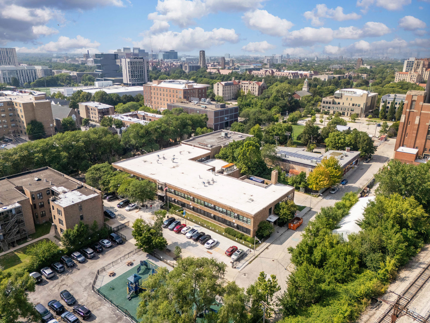 6104 South Dorchester Avenue, Unit 1S Chicago, IL 60637 - Photo 14 of 16 an aerial view of a house with a yard basket ball court and outdoor seating