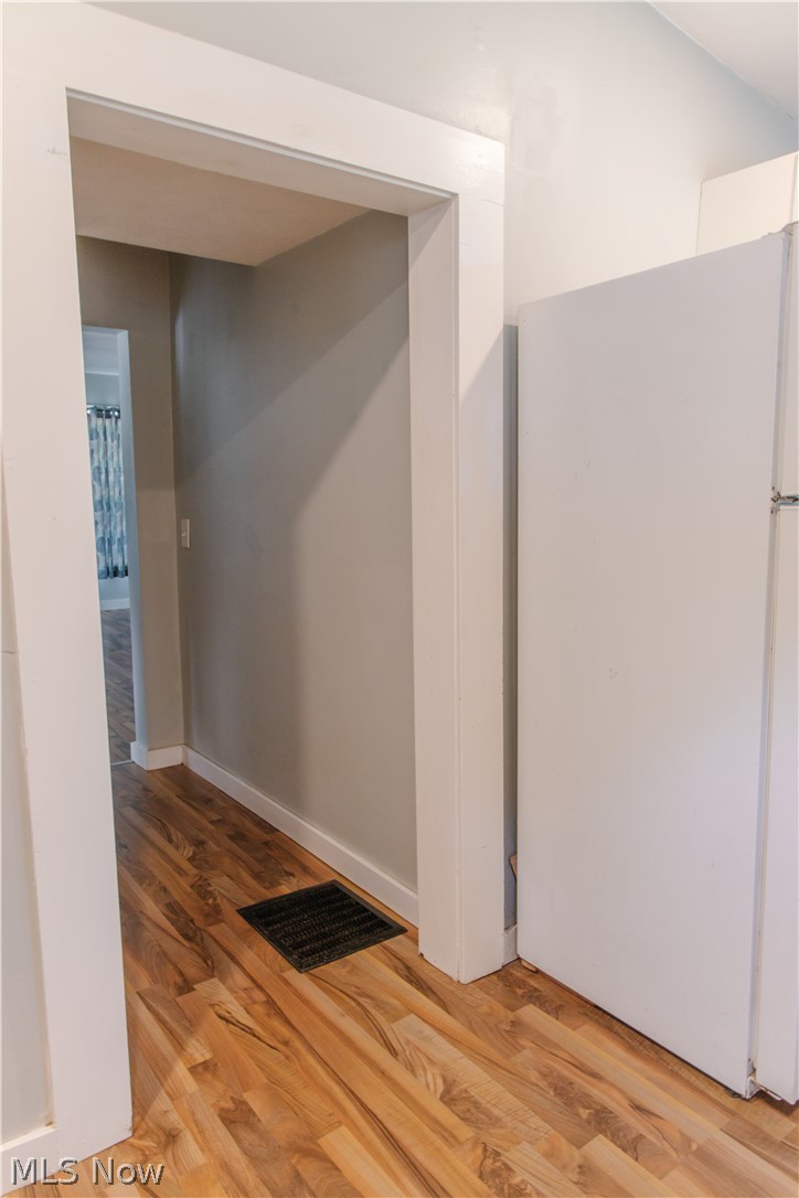 180 South Ridge Road West Geneva, OH 44041 - Photo 11 of 40 Hall with light wood-type flooring