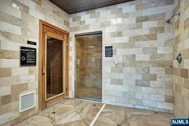 a projector room with furniture a projector and screen