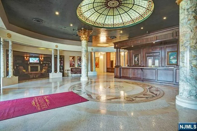 a bedroom with two beds and a couch