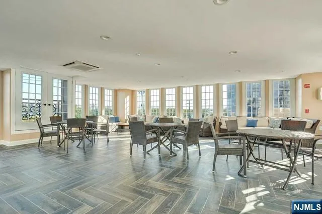 a room with gym equipment and a large window