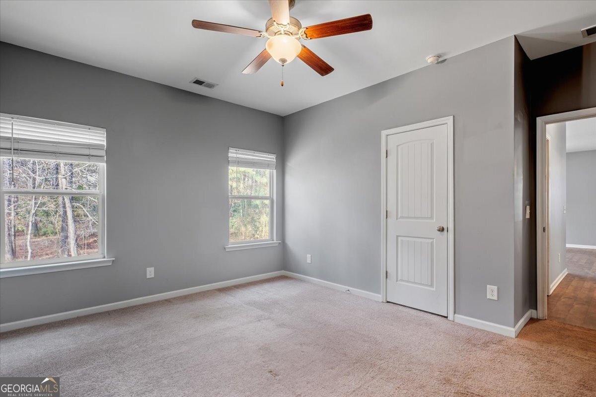 15 Grandberry Court Southwest Rome, GA 30165 - Photo 18 of 23 a view of an empty room with window and a kitchen