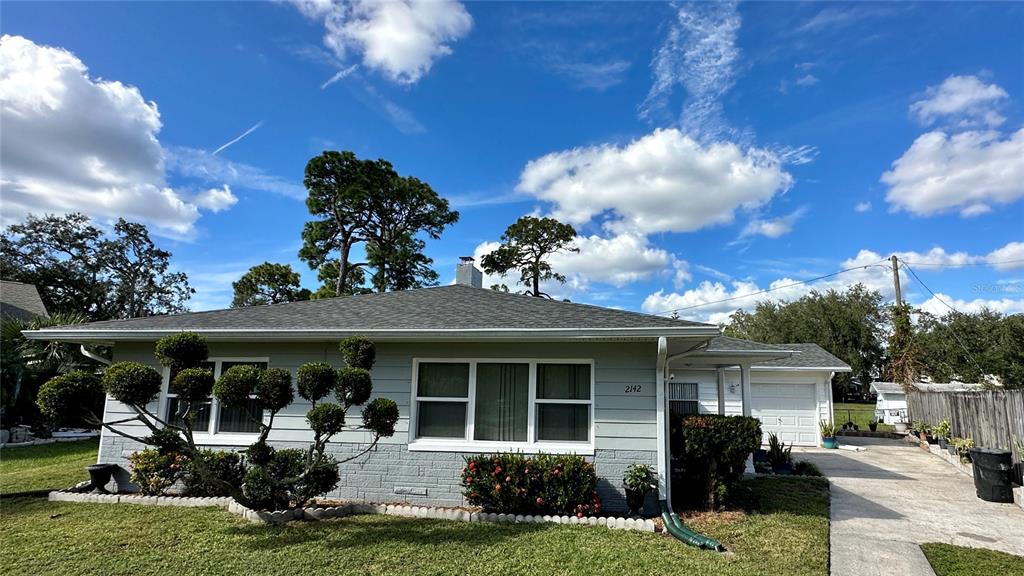 2142 Telogia Court Holiday, FL 34690 - Photo 1 of 1 a front view of a house with a porch