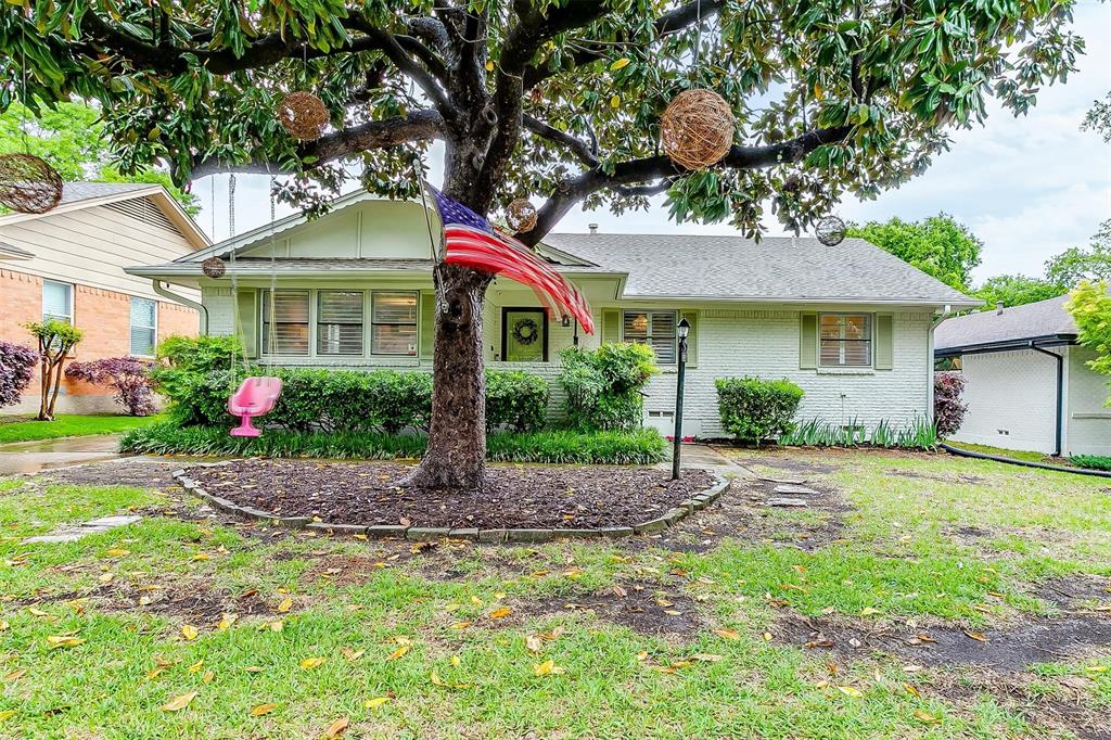 10657 Lakemere Drive Dallas, TX 75238 - Photo 1 of 1 a front view of a house with garden