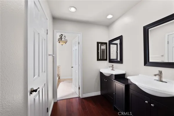 a bathroom with a double vanity sink and mirror