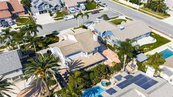 an aerial view of residential house with pool and outdoor space