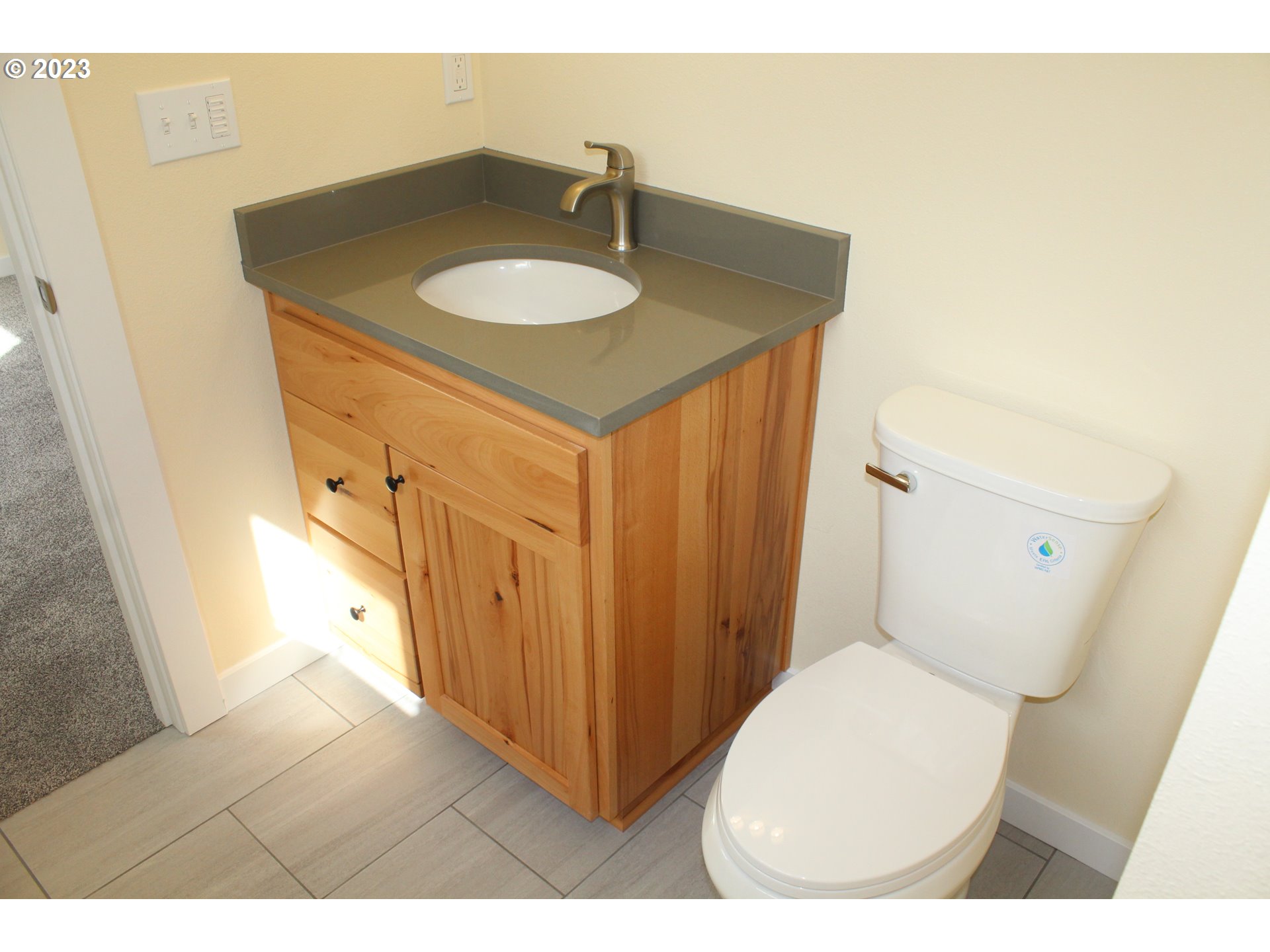 1384 10th Seaside, OR 97138 - Photo 15 of 36 a bathroom with a sink and a toilet